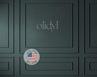 May include: A dark teal wall featuring a classic wainscoting panel design with raised rectangular molding. Centered on the wall is the text "olidyl" in a light gray font. A circular badge displays the American flag with the text "SHIPS FROM NJ, USA".