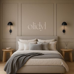 May include: A bedroom interior with a bed dressed in neutral tones, a grey throw, and pillows. Two black wall-mounted lamps are either side of the bed. The walls are a neutral colour, and there are two small wooden bedside tables.