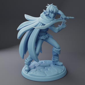 May include: A light blue figurine of a fantasy character in a dynamic pose, holding a blade. The figure wears a flowing cape, fitted pants, and boots. The base is a textured, circular platform.