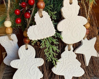 Christmas design on white Beaded Clay ornaments or gift tags, farmhouse decor, rustic. Star, heart, gingerbread, tree, stocking, snowman