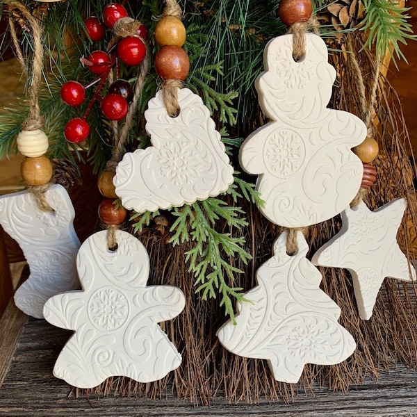 Christmas design on white Beaded Clay ornaments or gift tags, farmhouse decor, rustic. Star, heart, gingerbread, tree, stocking, snowman