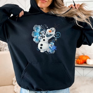 May include: Black hoodie with a graphic print of Olaf from Frozen. The graphic features Olaf with a blue and white snowflake design.