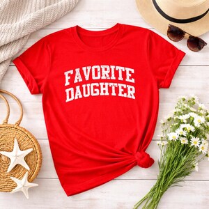 May include: A distressed wooden sign with the words "Welcome to our home" in white lettering. The sign has a rustic finish, ideal for a front porch or hallway, creating a welcoming atmosphere.