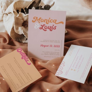 May include: Wedding invitation suite with pink and orange details. The main invitation card features the names "Monica & Louis" in a retro font. The date is August 12, 2028. The RSVP card has a pink and white color scheme.
