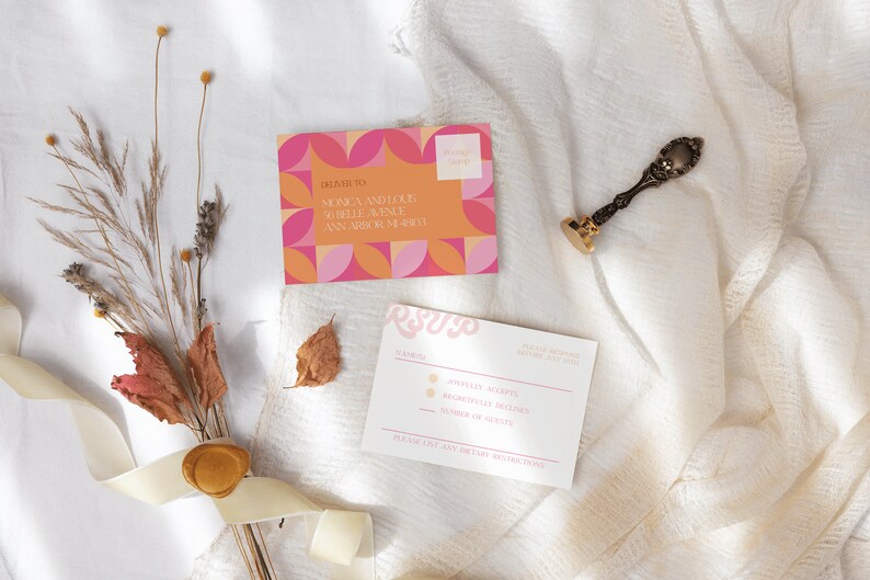May include: A pink and orange geometric patterned wedding invitation with the text "RSVP" on a white card with a wax seal and dried flowers.