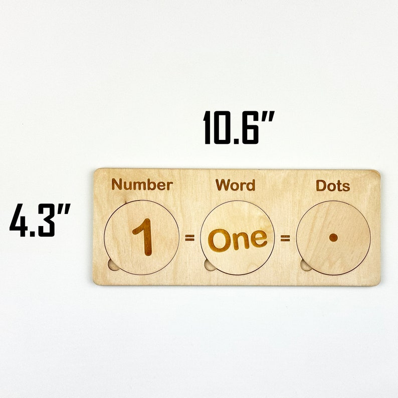 May include: Wooden learning tool with three sections labeled "Number", "Word", and "Dots". The first section shows the number "1", the second section shows the word "One", and the third section shows a single dot. The tool measures 10.6 inches long and 4.3 inches wide.