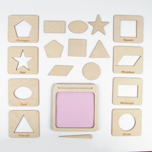 May include: Wooden shapes with cutouts for tracing, including a star, circle, square, triangle, rhombus, oval, rectangle, pentagon, and a blank space for drawing. The shapes are on a white background.