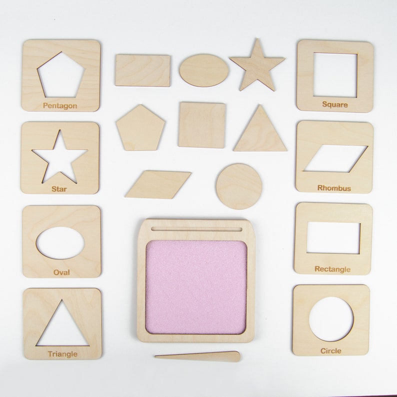 May include: Wooden shapes with cutouts for tracing, including a star, circle, square, triangle, rhombus, oval, rectangle, pentagon, and a blank space for drawing. The shapes are on a white background.