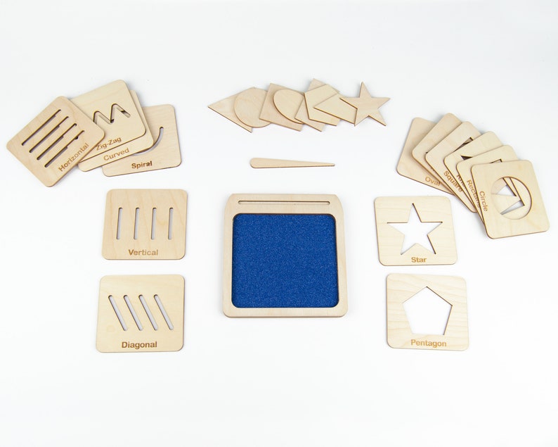 May include: Wooden educational toy with a blue felt board and various shapes and lines cutouts. The shapes include a star, circle, oval, pentagon, and rectangle. The lines include horizontal, vertical, diagonal, curved, zig-zag, and spiral.