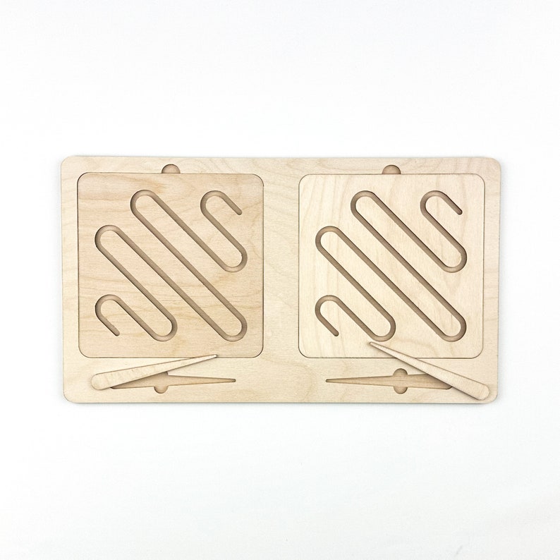 May include: Wooden maze toy with two separate mazes and two wooden sticks for navigating the mazes.