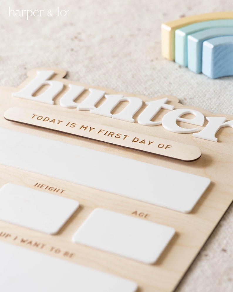 May include: A wooden growth chart with the name "hunter" in white letters. The chart has spaces to record the child's height, age, and a section that says "Up I want to be".