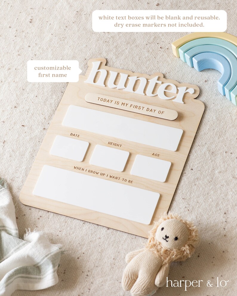May include: A wooden growth chart with a white text box for a customizable first name. The chart has the text "hunter" and "TODAY IS MY FIRST DAY OF". There are white text boxes for date, height, age, and "WHEN I GROW UP I WANT TO BE".