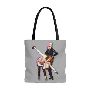 May include: A gray tote bag with a colorful image of two women. One woman is wearing a black leather jacket and the other is wearing a white shirt and black pants. The women are posing in a playful manner.