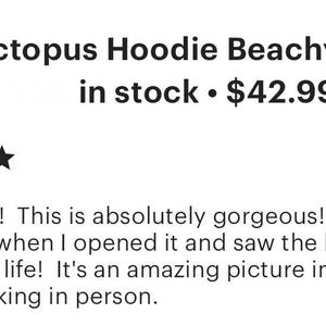 May include: A brown hoodie with a large octopus graphic on the back. The octopus is surrounded by a beach scene with palm trees and waves. The hoodie has a drawstring hood and a kangaroo pocket. The text "Octopus Hoodie Beachy Hood... in stock $42.99" is visible in the image.