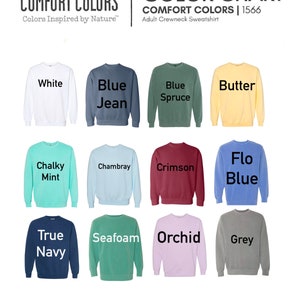 Pode incluir: Tabela de cores de camisolas de gola redonda para adultos Comfort Colors. O gr&aacute;fico mostra v&aacute;rias cores, incluindo branco, azul jeans, azul abeto, manteiga, menta giz, chambray, carmesim, azul flo, azul marinho, espuma do mar, orqu&iacute;dea e cinza.