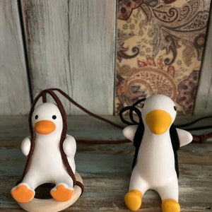 Swinging rearview mirror ducks.