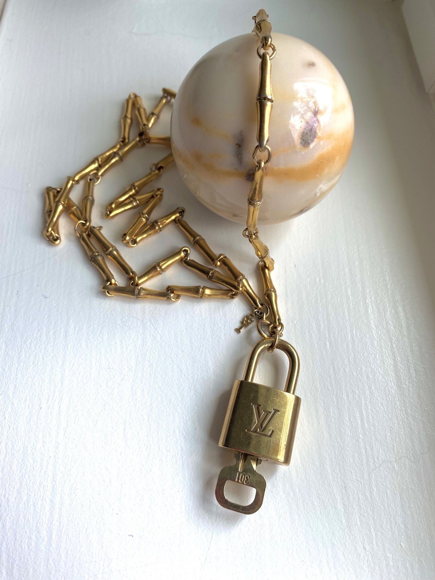 Authentic Louis Vuitton LV Lock Pendant