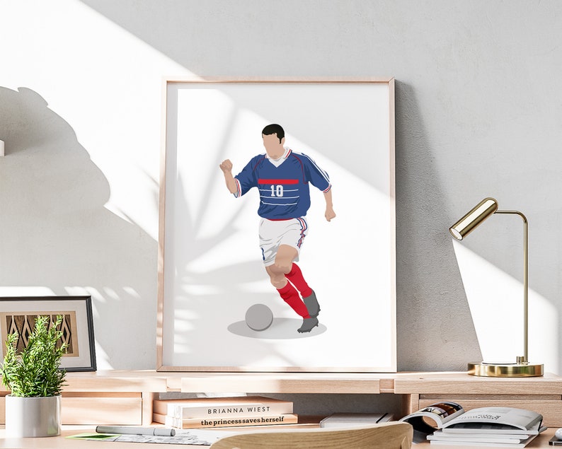 May include: A digital illustration of a soccer player wearing a blue and white jersey with the number 10 on it. The player is dribbling a soccer ball with his right foot. The background is white.
