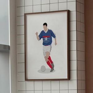 May include: A framed illustration of a soccer player in a blue and white jersey with the number 10 on the front, dribbling a soccer ball. The player is wearing red socks and black cleats.