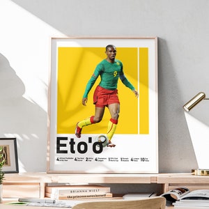 May include: A yellow and white poster with a photo of a soccer player in a green and red jersey. The player is dribbling a soccer ball. The poster has the text "Eto'o'" in black letters. The poster also has a list of the player's accomplishments, including "African Footballer of the Year", "Top Scorer", "Africa Cup", "Champions League", "World Cup", "League Cup", "Premier League", "Goals", and "Titles".