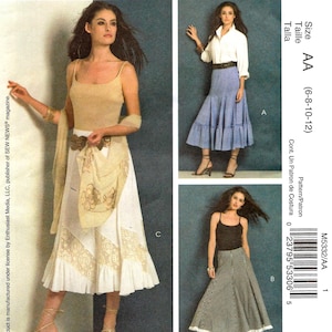 May include: McCall's sewing pattern M5332 featuring three skirt designs. The pattern includes sizes AA (6-8-10-12). The image shows models wearing the finished skirts, including a white skirt with lace details and a black and white checkered skirt.