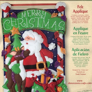May include: Felt applique kit featuring a Christmas banner design. The banner includes a Santa Claus, reindeer, and the words "Merry Christmas." The banner measures approximately 15" x 22".