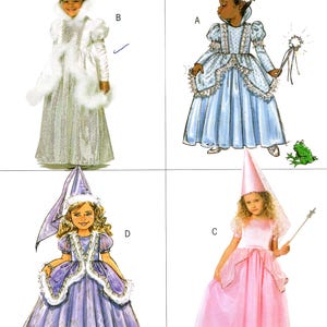 May include: A sewing pattern sheet featuring four costume designs: a silver dress with a white fur-trimmed coat labeled B, a light blue dress with a wand and frog labeled A, a purple dress with a pointed hat labeled D, and a pink dress with a wand labeled C.