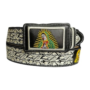 May include: Black leather belt with white embroidery and a silver buckle featuring an embroidered image of the Virgin Mary.