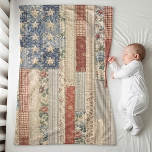 May include: A rectangular patchwork quilt featuring a stylized American flag design composed of various floral, plaid, and striped fabric patterns in shades of red, white, and blue, with cream-colored stars appliqued on a blue background.
