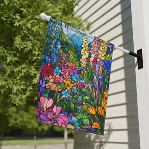 May include: A colourful garden flag with a stained glass design featuring a variety of flowers in shades of pink, purple, blue, yellow, and orange.