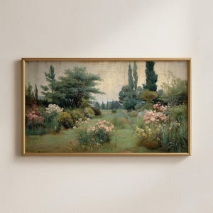 May include: A framed landscape painting depicts a serene garden scene. The artwork features a pathway through a lush green lawn, bordered by flowering bushes in shades of pink and white. Tall trees and foliage create a sense of depth, with a soft, golden sky.