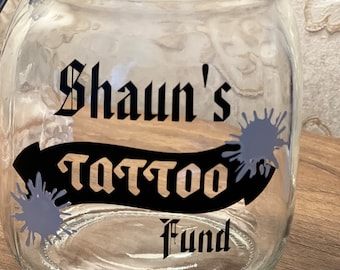 Personalised Tattoo glass money jar. Savings jar. 2 sizes ….Money jar, coins and notes.
