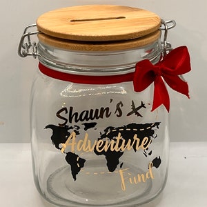 Personalised Adventure glass jar Money Box . Piggy bank with money slot.