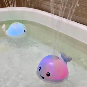 Baby bath whale toy with spraying water and lights