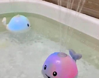 Baby bath whale toy with spraying water and lights