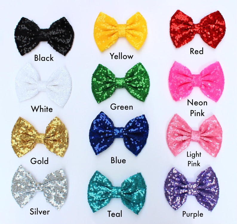 May include: A collection of sequined bow ties in various colors, including black, yellow, red, white, green, neon pink, gold, blue, light pink, silver, teal, and purple. Each bow tie has a matching color label underneath.
