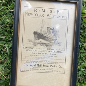 May include: A vintage advertisement for the Royal Mail Steam Packet Co. featuring a black and white illustration of a ship sailing on the ocean. The advertisment includes the text "RAMASAP NEW YORK-WEST INDIES" and lists destinations including Santiago, Cuba, Kingston, Jamaica, Colon, Panama, and Colombia. The advertisment also includes the text "Attractive 23 Day Cruises" and "Fortnightly Sailings from New York".