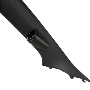 May include: A black plastic car interior panel with a round black gauge mounted on it.