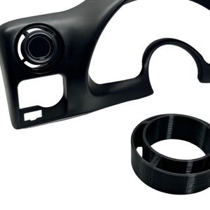 May include: Black plastic dashboard gauge pod with a round gauge and a vent. A black plastic ring is also included.
