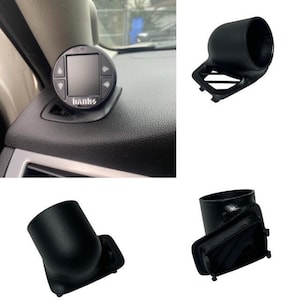 May include: A black Banks gauge with a digital display and arrow buttons, mounted on a car dashboard. Additional images show black gauge pods in various configurations, designed for automotive use.