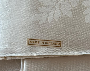 Set of 12 Ivory Vintage Irish Linen Double Damask Napkins with Original Made in Ireland Stickers still on some of them.