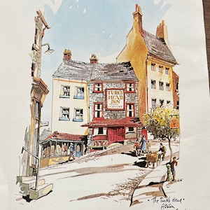May include: A watercolor painting of a quaint English village scene with a pub called "The Turk's Head Inn" in the center. The pub has a red door and a sign above it. The buildings are made of stone and have slate roofs. The street is cobblestone and there are people walking on it.