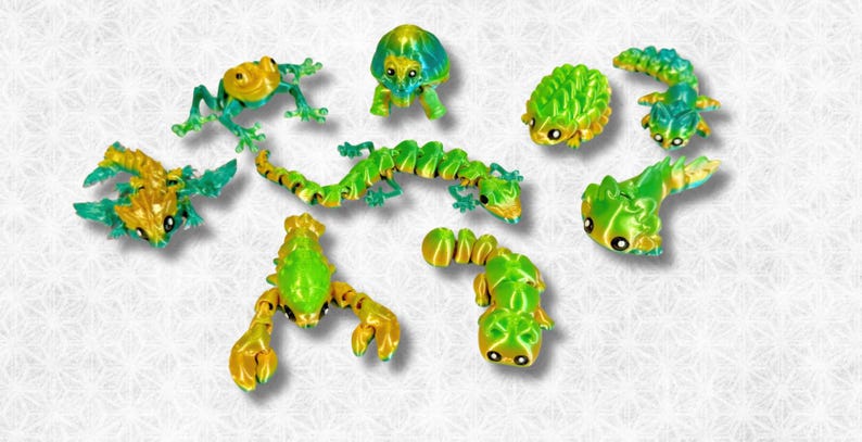 Peut inclure: Une collection de neuf petites figurines d'animaux peintes &agrave; la main, de couleurs vives, comprenant une grenouille, une tortue, un scorpion et un l&eacute;zard. Les figurines sont faites d'un mat&eacute;riau lisse et brillant et pr&eacute;sentent une palette de couleurs vives vert et jaune.