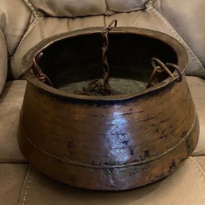 Antique Hammered Copper Cooking Pot with Iron Chain and Rings.
