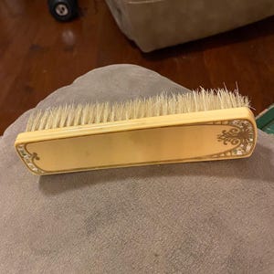 Vintage 1940’s Beautiful Decorative Beige Clothes Lint Brush With Beautiful Decorative Designs on the Back and Brush is in Good Condition!!!