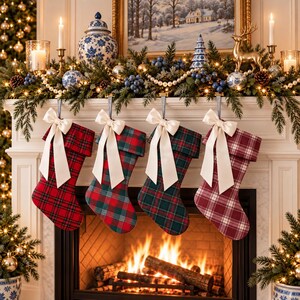 May include: Four Christmas stockings hanging in a row, each featuring a different plaid pattern in red, green, and burgundy. Each stocking is adorned with a large, cream-colored satin ribbon bow tied at the top cuff, creating a festive display.
