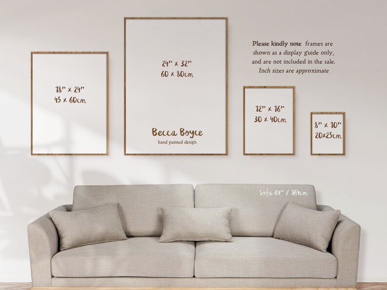 Four frames hung about a sofa in a sunlit room. The four frames are different sizes to show how different print sizes look when framed on a wall. A note reads - frames are shown as a display guide only, and are not included