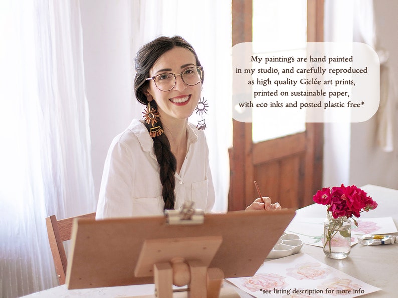 A photo of the artist in her studio, painting flowers. The text reads - My paintings are hand painted in my studio, and carefully reproduced as high quality Giclée art prints, printed on sustainable paper, with eco ink and posted plastic free.