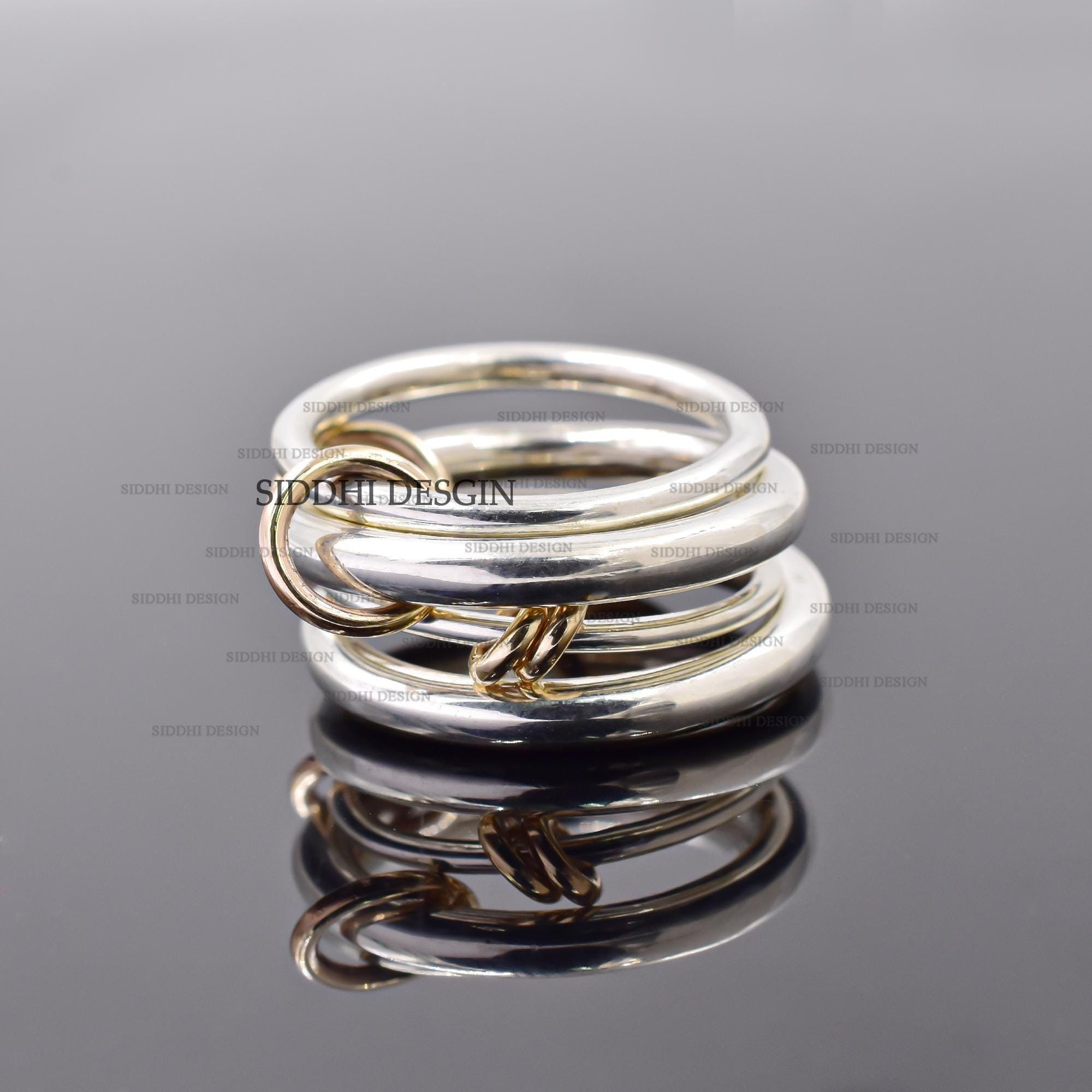 14K solid yellow gold jumps, silver multi-band ring, and plain silver connector link band ring.