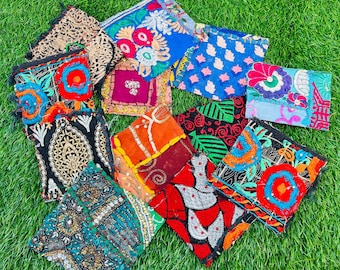 May include: Assortment of colorful fabric squares with intricate embroidery and beading. The squares are made of various fabrics, including cotton, silk, and velvet. The embroidery is done in a variety of colors, including red, blue, green, and yellow. The beads are also in a variety of colors and sizes.